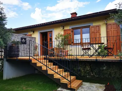 a house with a deck and a staircase at ČEBRON FAMILY ESTATE in Branik