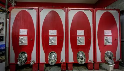 a row of red fire hydrants in a building at ČEBRON FAMILY ESTATE in Branik