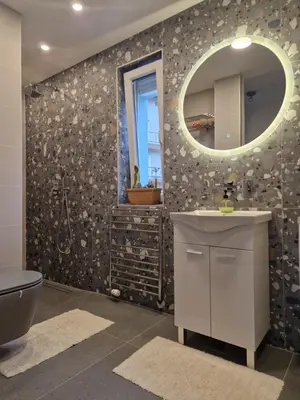 a bathroom with a sink and a mirror at Bergmannhaus in Zagorje ob Savi