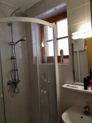 a bathroom with a shower and a sink at Apartment Trobentica 40 Moravske Toplice - SPA in Moravske Toplice