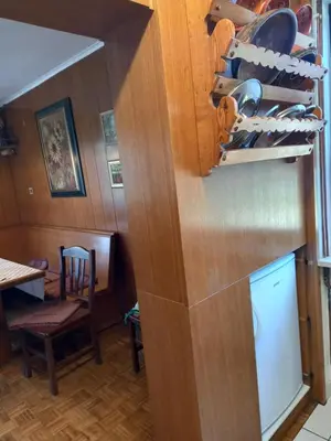 a kitchen with a shelf with shoes on it at Country House Aleš in Gornja Bistrica