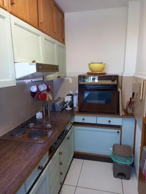 a kitchen with a microwave and a stove top oven at Country House Aleš in Gornja Bistrica