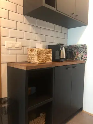 a kitchen counter with a coffee maker on it at Birch central studio on main square in Ljubljana