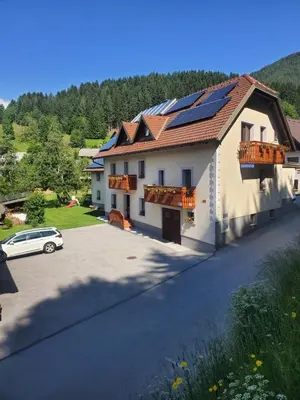 a house with solar panels on the roof at Apartma Lip in Rateče