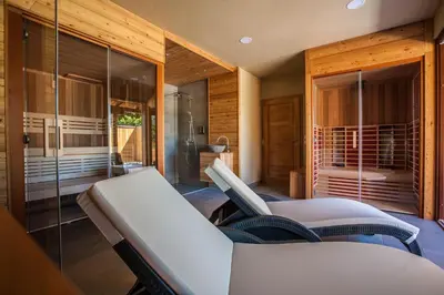 a room with two beds and a shower at Tourist Farm Kranjc in Kobarid