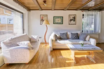 a living room with a couch and a table at Castle way Apartments Tamy in Bled