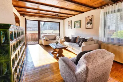 a living room with a couch and chairs and a table at Castle way Apartments Tamy in Bled