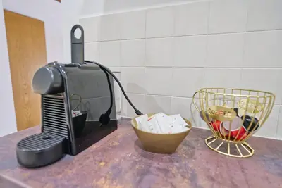 a kitchen counter with a blender and a bowl on it at Castle way Apartments Tamy in Bled