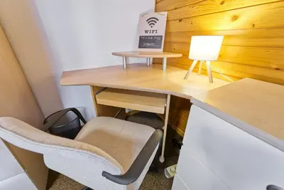 a desk with a chair and a box on it at Castle way Apartments Tamy in Bled
