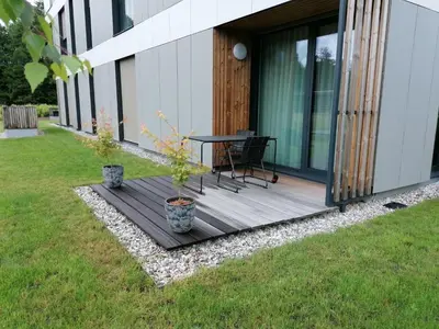 a wooden deck on the side of a house at Regentova Suites Ljubljana in Ljubljana