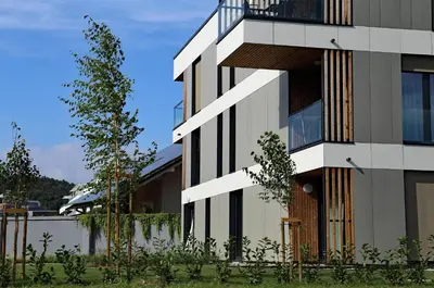 a building with a balcony on the side of it at Regentova Suites Ljubljana in Ljubljana