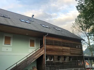 a house with a roof with solar panels on it at BC10 in Bovec