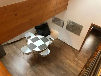 a dining room table and chairs in a room at BC10 in Bovec