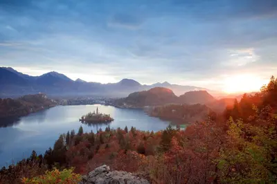 an island in the middle of a lake at Sunset Bled in Bled