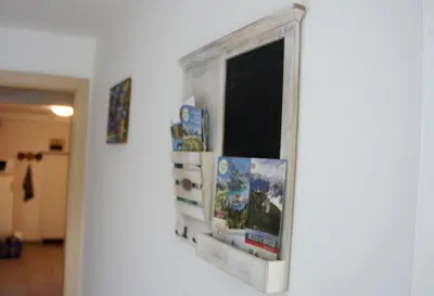 a mirror hanging on a wall in a room at Sunset Bled in Bled