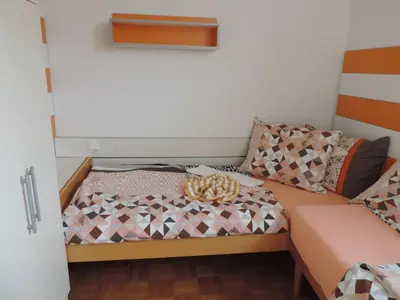a small room with a bed with at Marijin dom - Retreat House in Bled