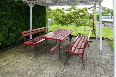 a picnic table and a bench on a patio at Orchid room for 2, Skylight room for 2 in Kranj