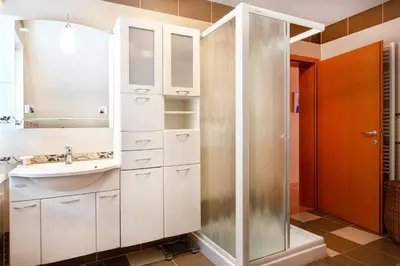 a bathroom with a sink and a shower at Orchid room for 2, Skylight room for 2 in Kranj