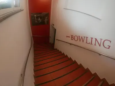 a stairway with a sign that reads bowling at Gostišče pri Slavcu in Šentjernej