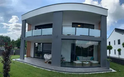 a modern house with a large glass facade at Genius Guest Unique Banovci Apartment in Banovci