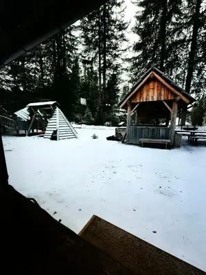 a gazebo with snow on the ground at Chalet Stara Jelka Pokljuka in Zgornje Gorje