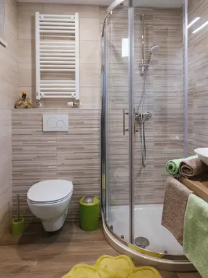 a bathroom with a shower with a toilet and a sink at Blue Door in Lesce