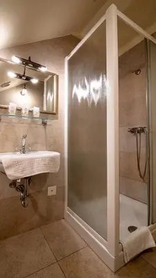 a bathroom with a shower and a sink at VEGANFRESH in Medvode