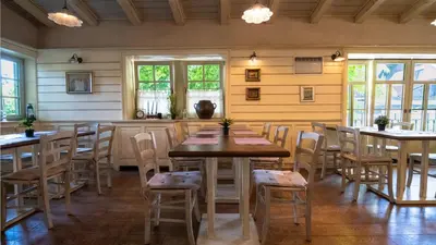 a dining room with wooden tables and chairs at VEGANFRESH in Medvode