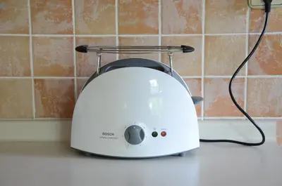 a white toaster sitting on a kitchen counter at Architect’s house - peaceful and minimalistic in Bled
