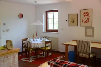 a dining room with a table and chairs at Architect’s house - peaceful and minimalistic in Bled