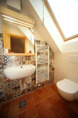 a bathroom with a sink and a toilet at Planinski dom Savica in Bohinj