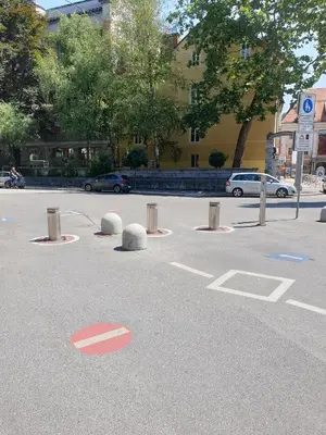 a parking lot with a red circle in the street at Love Nest apartment in Ljubljana