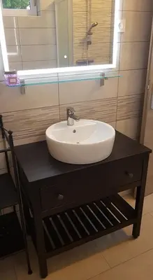 a bathroom with a sink and a mirror at Apartma Lahinja in Gradac