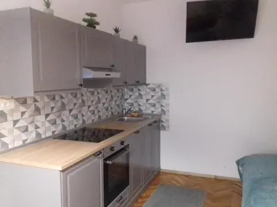 a kitchen with a sink and a counter top at Apartma Lahinja in Gradac