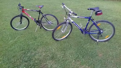 two bikes parked in the grass in a field at Apartma Lahinja in Gradac