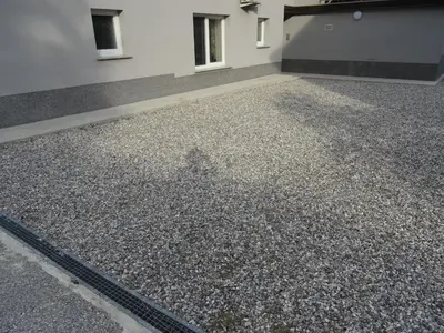 a large pile of gravel next to a building at Kramer Hiša in Kobarid