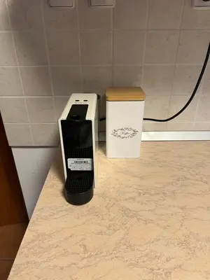 a phone sitting on a counter next to a box at Bella Mura Nature House I26 in Podčetrtek