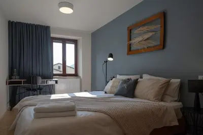 a bedroom with a bed with towels on it at Pr' Kramarju - House in the heart of Kobarid in Kobarid