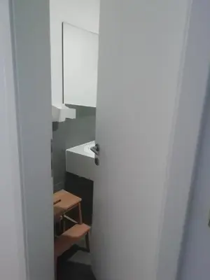 a bathroom with a sink and a white cabinet at CARNIOLAN HOUSE - GORENSKA HIŠKA in Radovljica