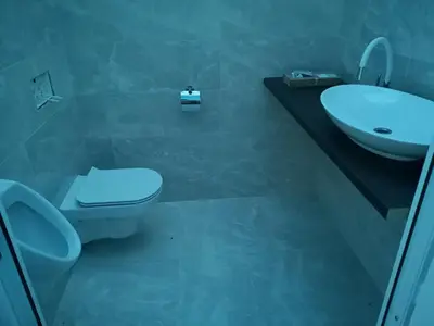 a bathroom with a white toilet and a sink at Homestay Free Park&Bikes in Ljubljana