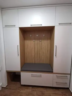a large white closet with wooden doors in a room at Apartma F&M in Bovec