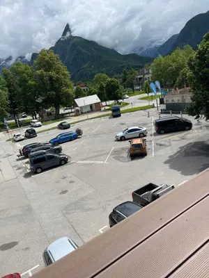 a parking lot with cars parked in a parking lot at Apartma F&M in Bovec