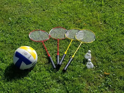 a group of tennis rackets and a soccer ball on the grass at Apartments Stankovo in Krška Vas