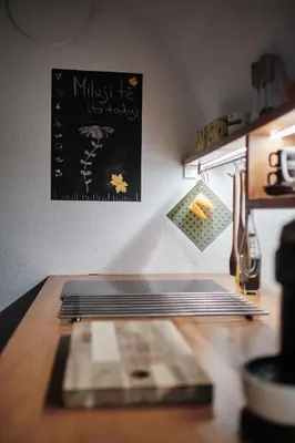 a kitchen counter with a chalkboard on the wall at Apartment Center in Kamnik