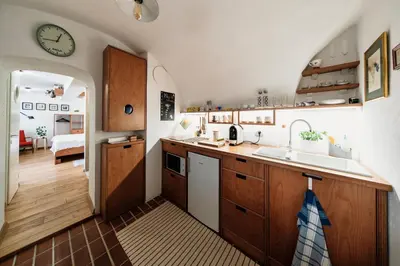 a kitchen with a sink and a counter top at Apartment Center in Kamnik
