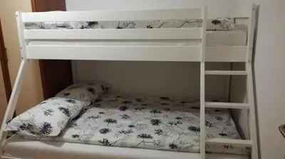 a bunk bed with a pillow on the bottom bunk at VILLA ČEH in Gabrovica pri Črnem Kalu