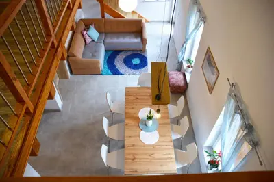 an overhead view of a living room with a couch and a table at HišaŠmihelka in Kobarid
