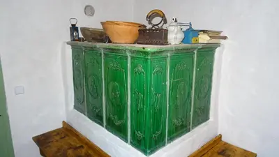 a green cabinet with various items on top of it at Homestay Kapl in Ledinek