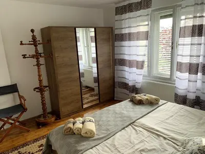 a bedroom with a bed with towels on it at House Amalia in Bled