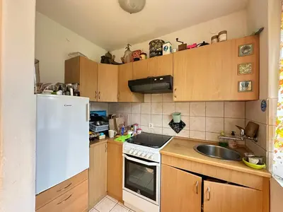a kitchen with a white refrigerator and a sink at House Amalia in Bled